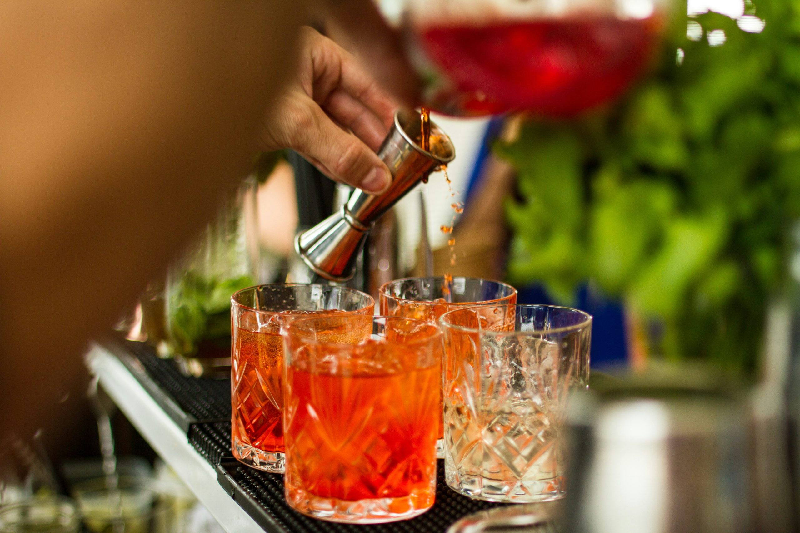 Bartender pouring a cocktail